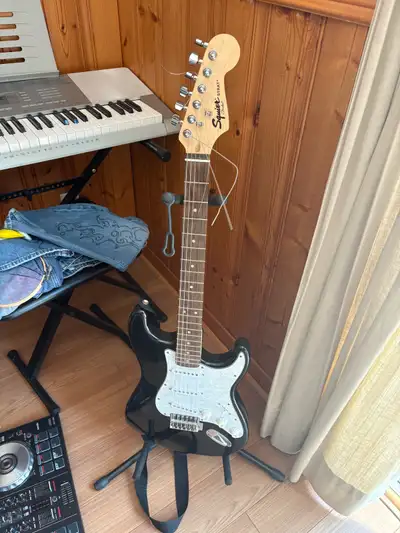 Fender squire Stratocaster Opened box and played for a day and never been used since Christmas. Blac...