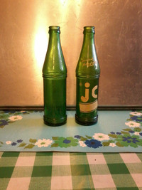2 vintage fairly rare JC, John Collins green glass pop bottles.