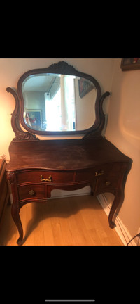 Antique mahogany dresser with beveled mirror