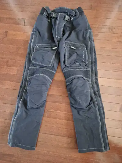 Women's motorcycle pants, size Small (8). Comes with knee armour. Great condition, selling as they a...