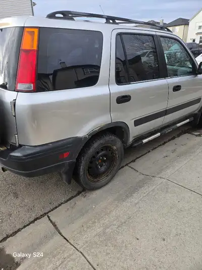 This is a 1999 Honda CRV, a reliable and versatile SUV perfect for city driving or weekend adventure...