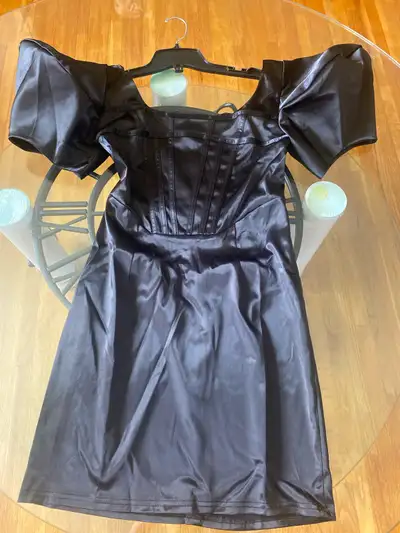 This is a Shein black party dress with short puffy sleeves in a size small, perfect for a night out!...