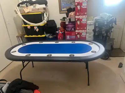 10 seat Poker table with cup holder. Dimensions 7ftx3.5ft. Couple of scratches on it. So it’s been t...