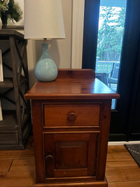 Brown Nightstand and Blue Lamp