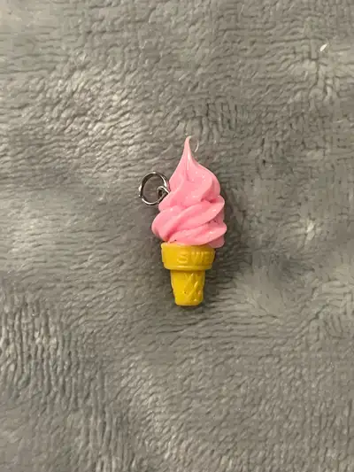 This adorable ice cream cone charm is perfect for adding a touch of sweetness to any necklace or bra...
