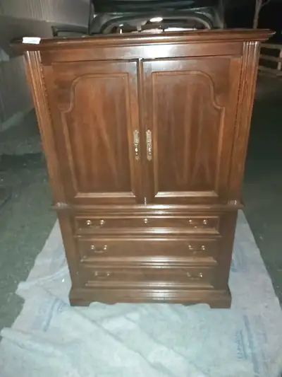 In very nice condition. Measurements: 39" across by 18"deep by 59 1/2" high. Delivery can be arrange...