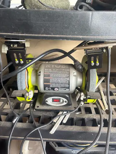Ryobi bench grinder, works well and both grinding wheels In good shape