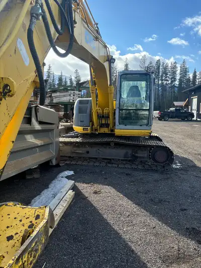Low hours at 4200 , Isuzu engine , pin grabber , thumb and three buckets , 58 ,42 and 28 inch diggin...
