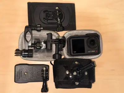 Dji action 4 action camera. Several accessories for attaching it to different surfaces. ND/polarizat...