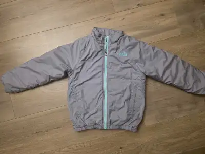 Size 6 kids North Face Jacket Grey/teal, no hood In good condition with 3 flaws circled on second pi...
