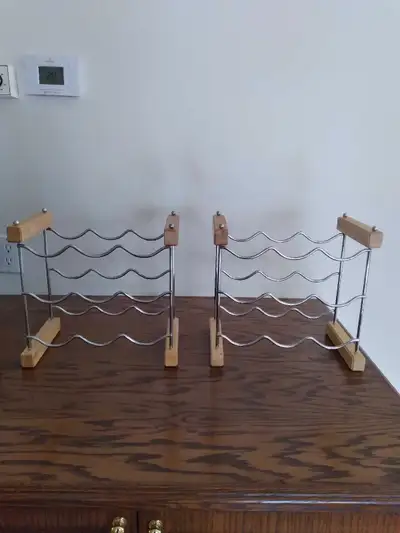 Space-saver stacking wine racks. Sturdy racks can be used singly or press together to create a doubl...