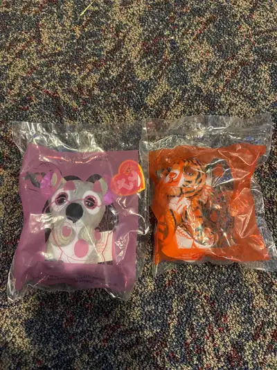 Two McDonald's Ty Beanie Boo plush toys. One is a tiger and the other a koala. Both are still in the...