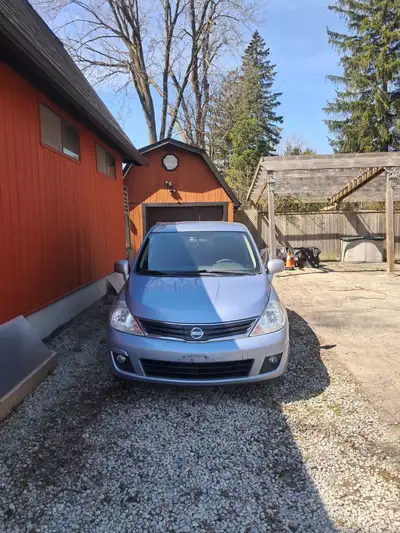 2012 Nissan Versa, runs prefect, 6 speed manual transmission, good interior Rear driver side door da...