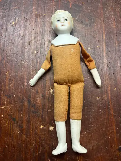  Small Antique German Bisque Doll – Cloth Body , View more