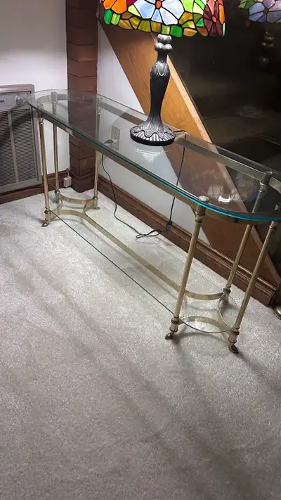 Brass and glass table in excellent condition. No chips , two levels