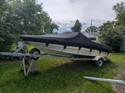 Also has bimini top but I bought a fitted tarp