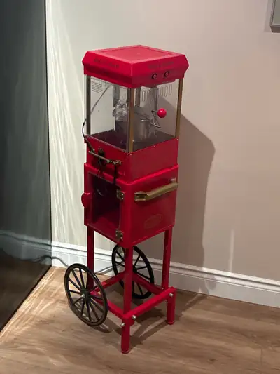 Add a touch of vintage charm to your home theatre with this Nostalgia popcorn machine! This unit is...