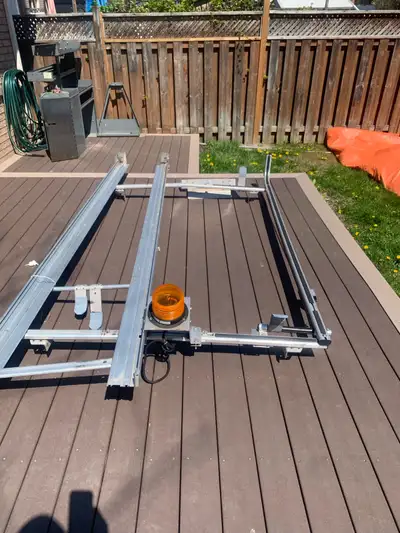 Barely used, universal aluminum ladder rack cable of hauling two fully assembled 24 foot ladders. Th...