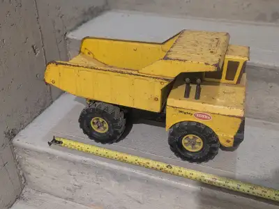 Vintage 1970's Metal Tonka Dump Truck, XMB-975 Yellow, Used Condition, Well Played with, wear to whe...