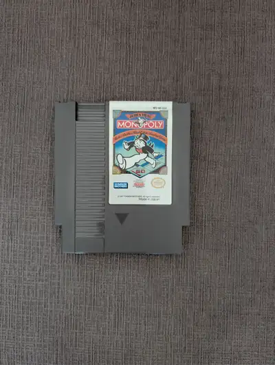 Selling a loose cartridge copy of Monopoly for the Nintendo Entertainment System (NES). The classic...