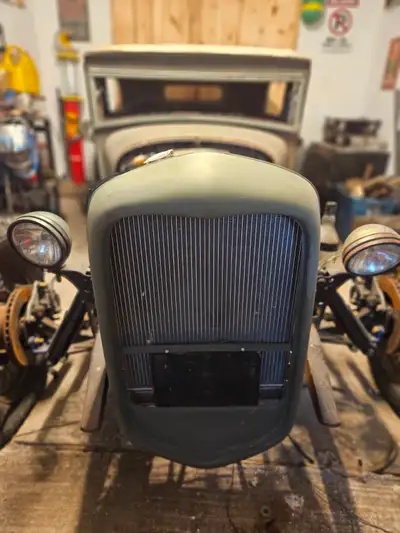 All steel model a hot rod. Chopped and channeled onto custom boxed and ze'ed frame. Frenched 64 falc...