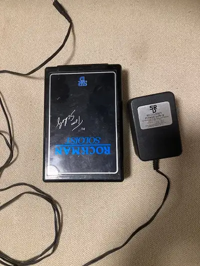 Rockman Soloist with power supply. No headphones with the unit. The battery door is missing. Asking...