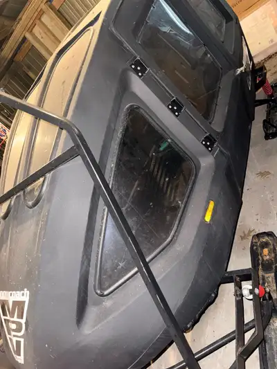 Four seater, inclosed cutter! Purchased for baby seats to skidoo during the winter. No longer babies...