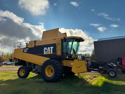 2002 480R CAT Combine. Has an updated Redekop chopper. Comes with pick up header and V535 Straight c...