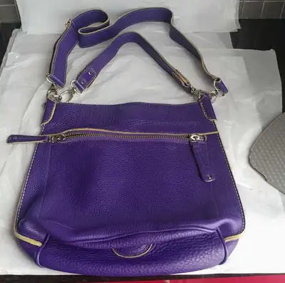 Roots leather bucket bag. New condition. Thick unlined purple leather with contrast stitching. Comes...