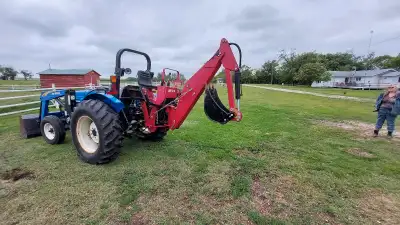 Backhoe attachment for farm tractor. PTO powered. New hydraulic pump. Cylinder has been refurbished...