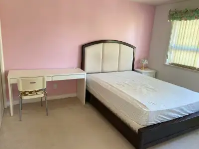 1 furnished modern-style bedroom suite available for rent. Includes a queen-sized bed, desk table an...