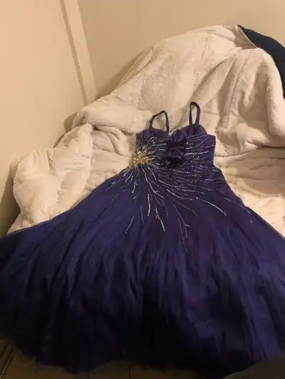 Dark purple formal/prom dress, never worn. Fits large/xl bodies. $150 OBO, will deliver within calga...