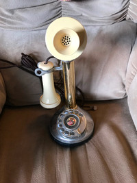 Chrome and ivory candlestick phone.