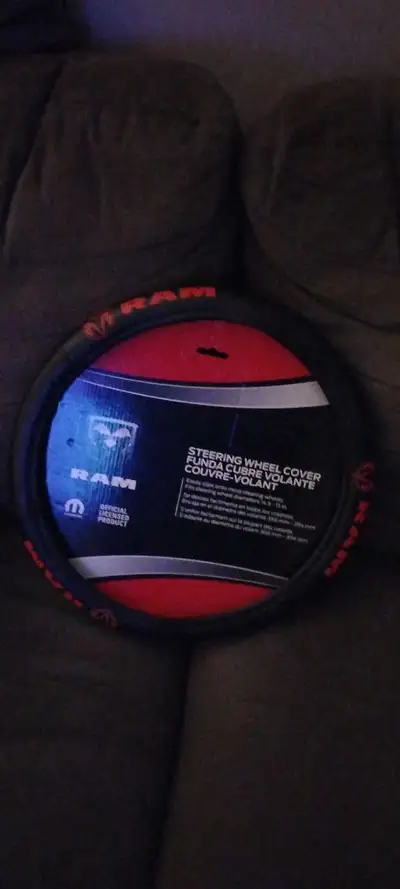 Keep your hands comfortable and stylish with this brand new Ram steering wheel cover, designed to fi...