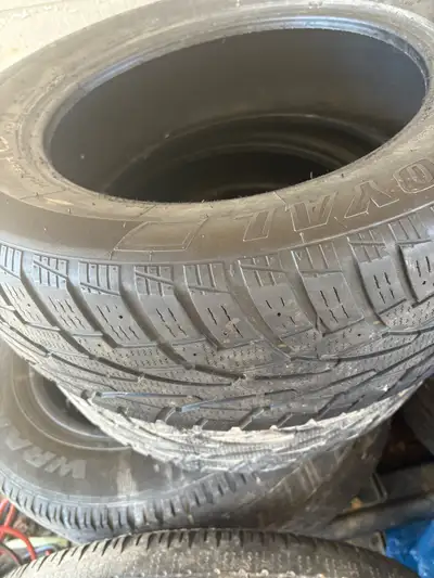 These are a set of used winter tires, size 225/65R17, ready to tackle the snowy roads with confidenc...