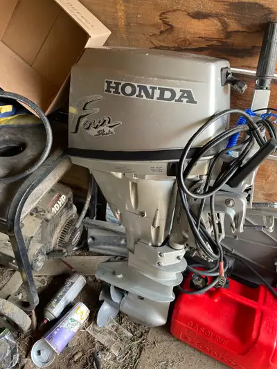 Honda 15 hp four stroke , electric start , tank included , runs but has a miss , needs tune up , dea...