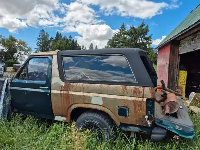 Three tops, the first one has broken windows original black $1000, first blue one has windows and or...