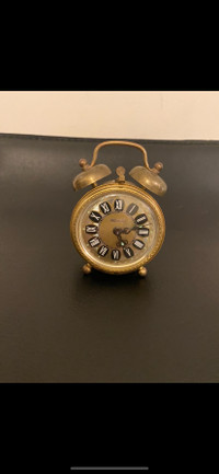 Vintage Blessing winding alarm clock on Connemara marble.