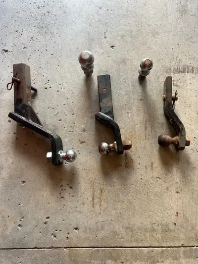 Assorted trailer hitches and balls. Two 2” drops and one 6” drop. 2 5/16 ball, 1 7/8 ball 25$ each b...
