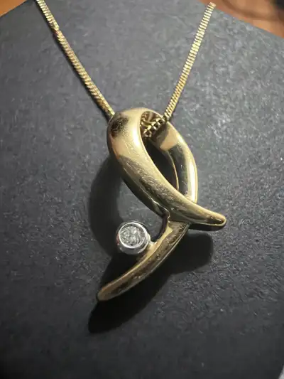10 k necklace with 1 diamond , View more