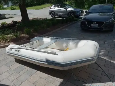 9ft Zodiac YL275R with flat rigid molded floor, rigid medium V fiberglass hull in good condition. Ha...