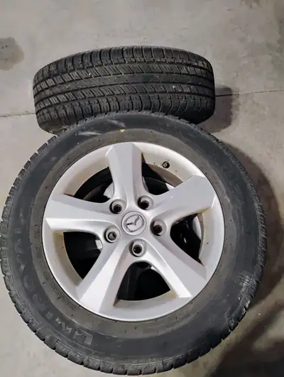 Set of 4, 15" aluminum alloy rims with approximately 16000 kms on the tires.