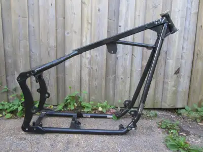 Pretty radical custom Harley Davidson softail frame. It's designed for a twin cam motor but it will...