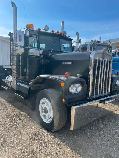 Trucks: A model Kenworths Green / black 1988 w900. 425 cat 15 speed Hendrix extended leaf. 17’ sws b...