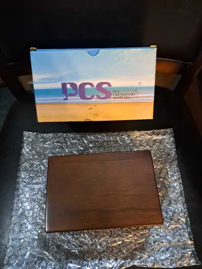 This is a new PCS Pet Crematory Supplies wooden urn. It's a beautiful and dignified way to honour yo...