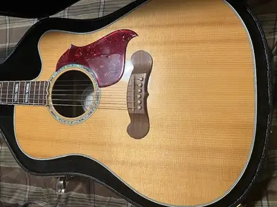 This 2016 Gibson Songwriter with a Venetian cut-away was crafted in Bozeman, Montana. The guitar has...