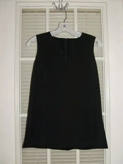 Several women's tops, cardigans, and vests for sale, View more