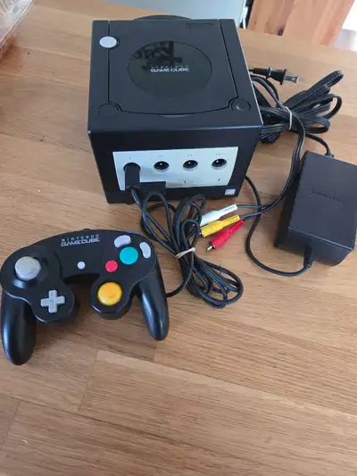 Nintendo GameCube DOL-101 console with one matching black controller. This bundle has the original p...