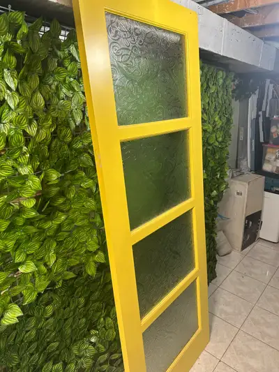 Add a pop of sunshine to your home with this vibrant yellow interior door, sized at 30x80 inches and...