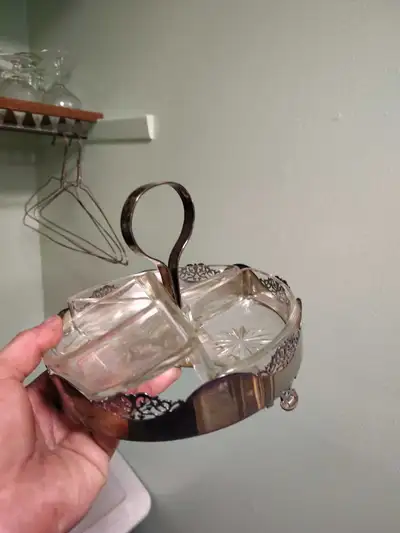 Add a touch of vintage elegance to your table with this used silver plated condiment server, featuri...